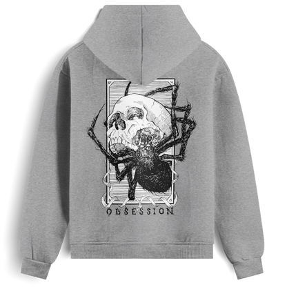 Back view of the grey Obsession hoodie from Haunt, showing a black and white tattoo-style skull being devoured by a spider, with the word “OBSESSION” beneath the design.