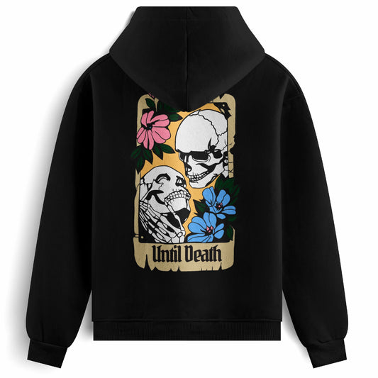 Back of the Until Death hoodie showing two skeletons in an embrace within a vintage card frame, with “Until Death” and tattoo-style floral details.