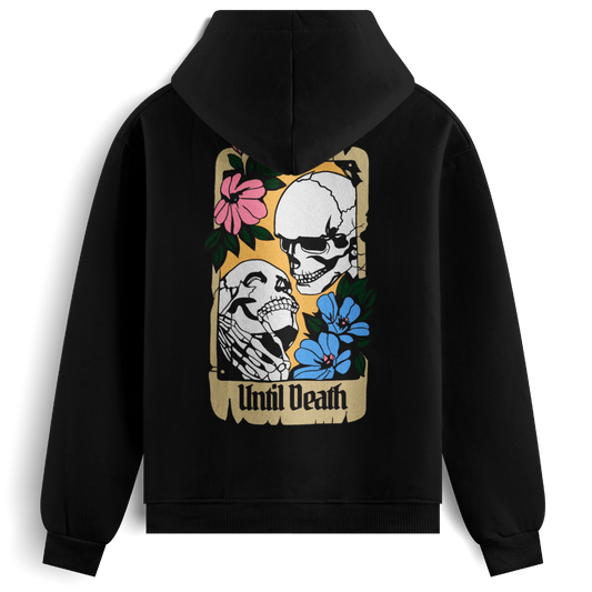 Back of the Until Death hoodie showing two skeletons in an embrace within a vintage card frame, with “Until Death” and tattoo-style floral details.