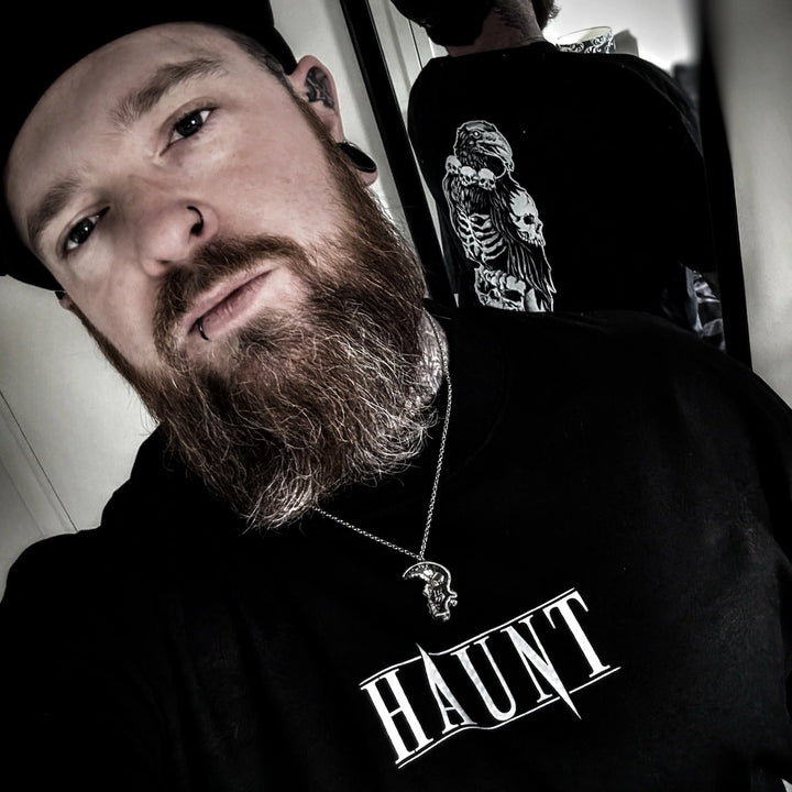 Oli wearing Haunt Bone Collector t-shirt, tattoo-inspired streetwear