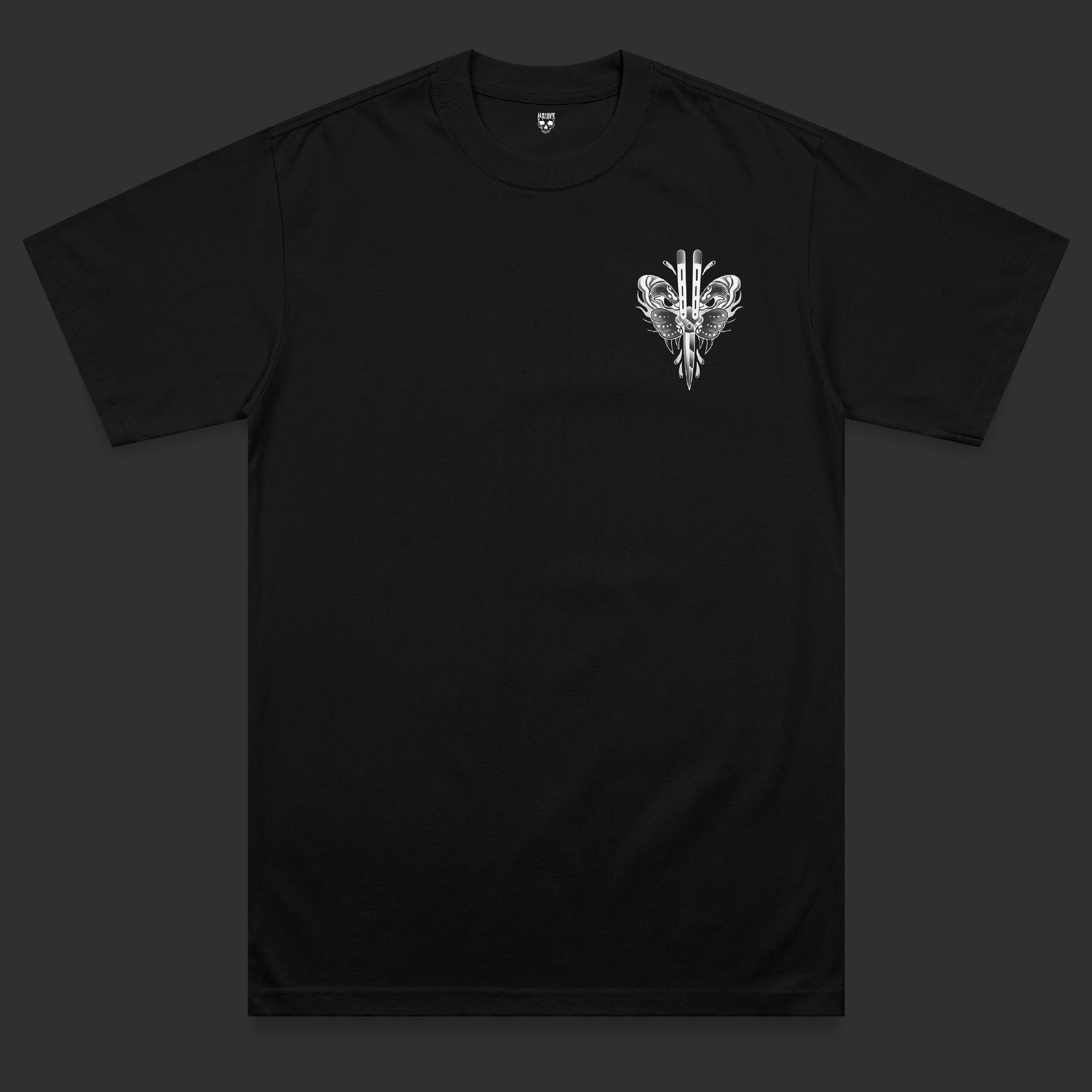 Front view of the Deadcute tattoo-inspired t-shirt featuring mirrored tiger head artwork surrounding a central butterfly knife in a symmetrical black and grey traditional tattoo design on a black heavyweight garment.
