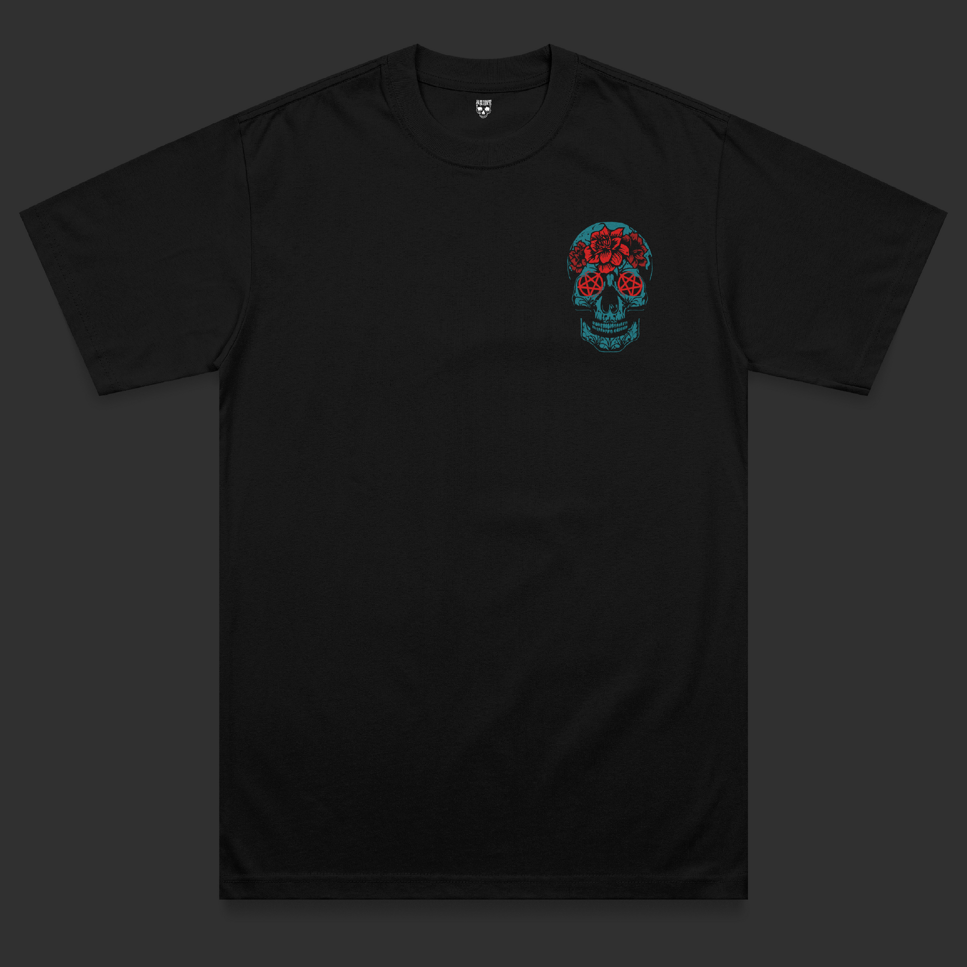 Front view of the Hexed heavyweight t-shirt featuring a bright blue skull chest print with red pentagram eyes and floral tattoo-inspired detailing on a black heavyweight garment.
