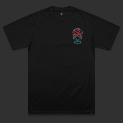 Front view of the Hexed heavyweight t-shirt featuring a bright blue skull chest print with red pentagram eyes and floral tattoo-inspired detailing on a black heavyweight garment.