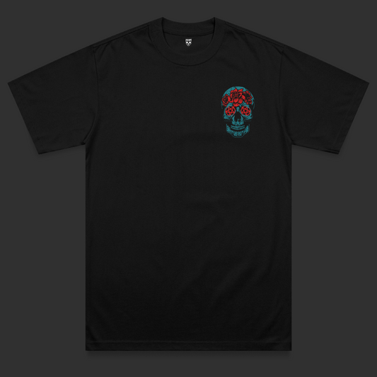 Front view of the Hexed heavyweight t-shirt featuring a bright blue skull chest print with red pentagram eyes and floral tattoo-inspired detailing on a black heavyweight garment.