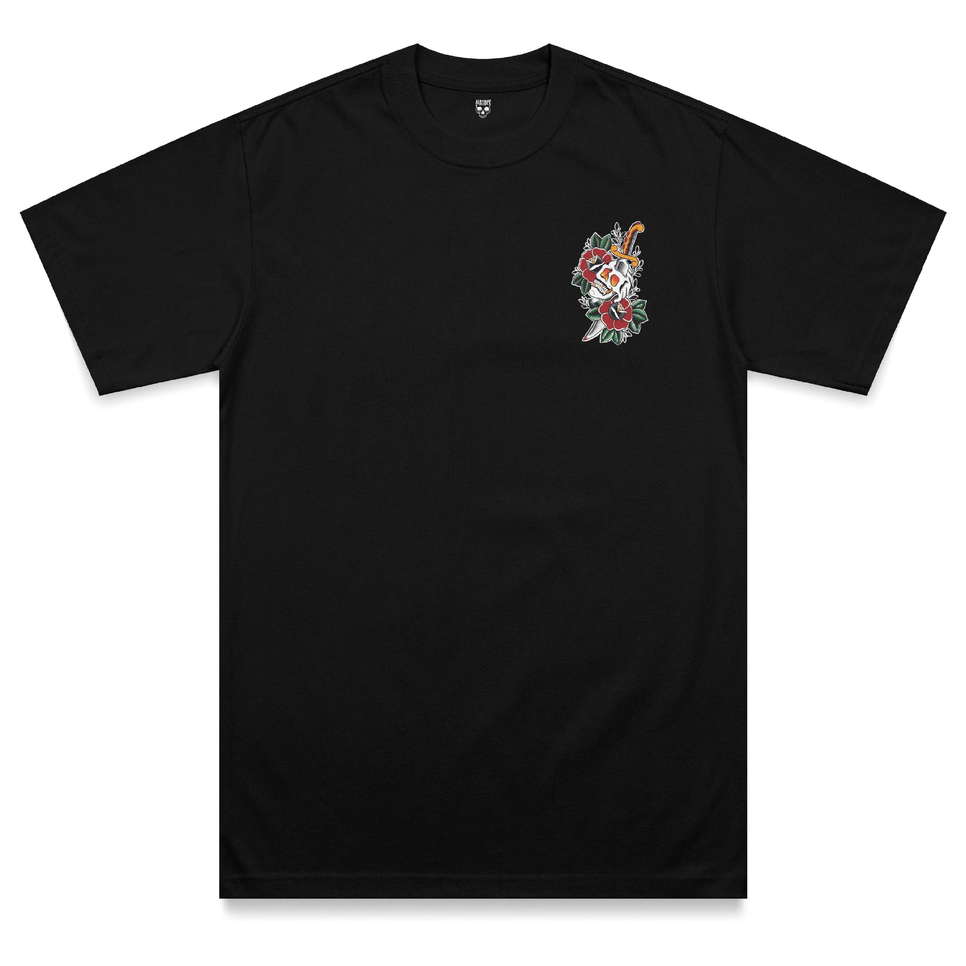 Front view of the Last Laugh heavyweight t-shirt featuring a traditional tattoo-inspired skull and dagger chest print surrounded by red flowers and green leaves on a black heavyweight garment.
