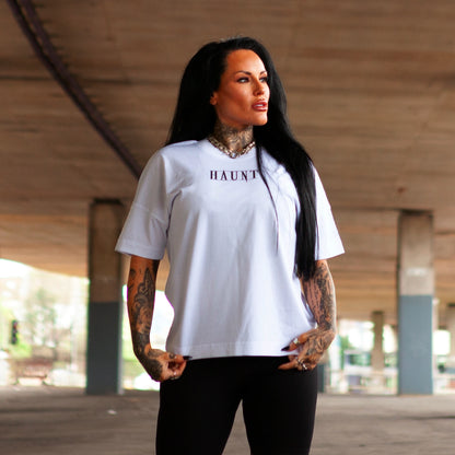Front view of Haunt's Obsession premium t-shirt showing the minimalist HAUNT logo in black ink on white cotton.