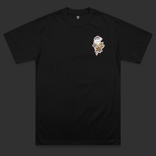 Front view of the Softcore Bloom heavyweight t-shirt featuring a traditional tattoo-inspired nude woman rising from a yellow rose with butterfly detailing on a black heavyweight garment.