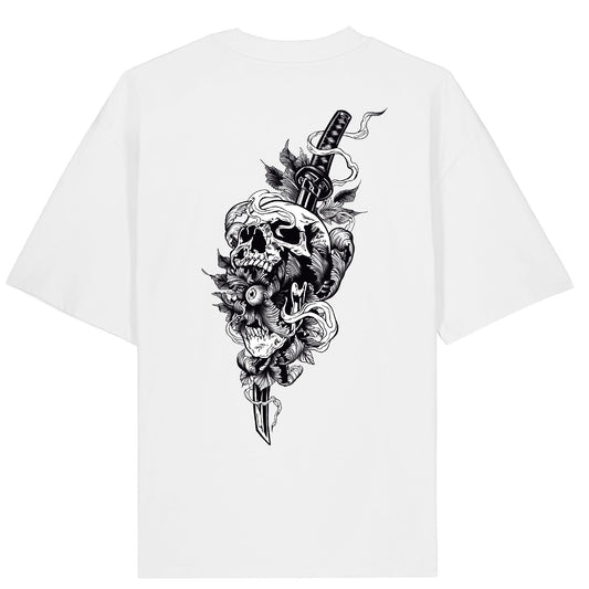 Back of the Katana Killer t-shirt featuring a skull with an eyeball in its mouth, pierced by a katana sword, surrounded by flower petals and banners in bold black and white traditional tattoo art.