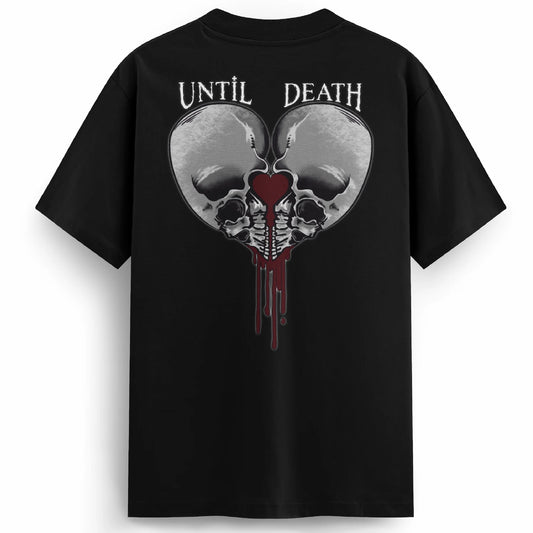 Back of the Love Kills tee with twin skulls framing a bleeding heart and the words “UNTIL DEATH” above in gothic tattoo lettering.