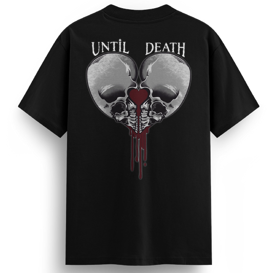 Back of the Love Kills tee with twin skulls framing a bleeding heart and the words “UNTIL DEATH” above in gothic tattoo lettering.
