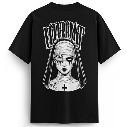 Black premium oversized t-shirt featuring a large back print of a sinister nun with stitched eyes, hollow pupils, and a gothic cross on her neck. “HAUNT” arches above the design in warped lettering.
