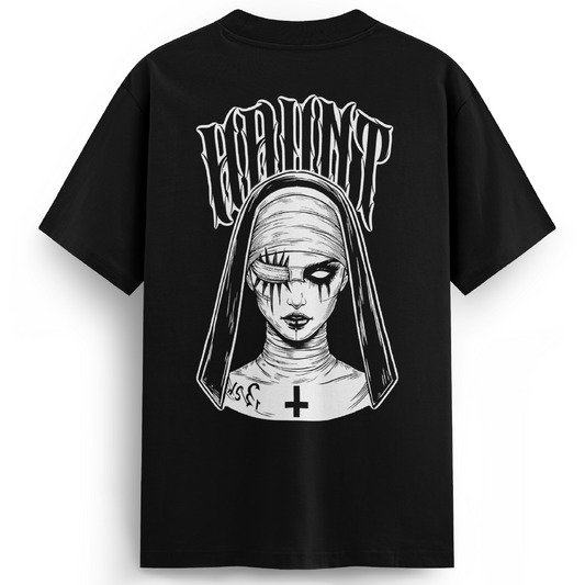 Black premium oversized t-shirt featuring a large back print of a sinister nun with stitched eyes, hollow pupils, and a gothic cross on her neck. “HAUNT” arches above the design in warped lettering.
