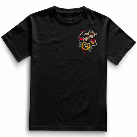 Front of the black Pocket Panther t-shirt from Haunt’s Pocket Collection featuring a bold traditional tattoo-style panther head above a classic rose, in vibrant red, yellow, green, and beige tones.