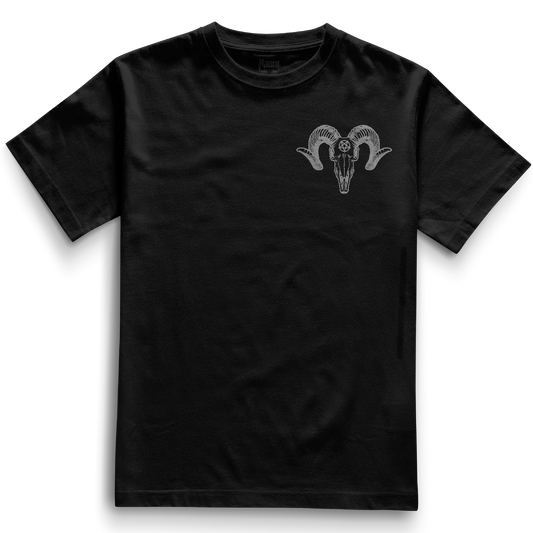Front of the black Pocket Ramskull t-shirt from Haunt’s Pocket Collection showing a grey ram skull with a pentagram on the forehead in tattoo style.
