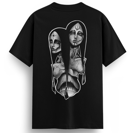 Back of the Siamese Sisters t-shirt featuring a black and grey tattoo-style design of conjoined women with symbolic marks on their foreheads, blending mystical and supernatural themes.
