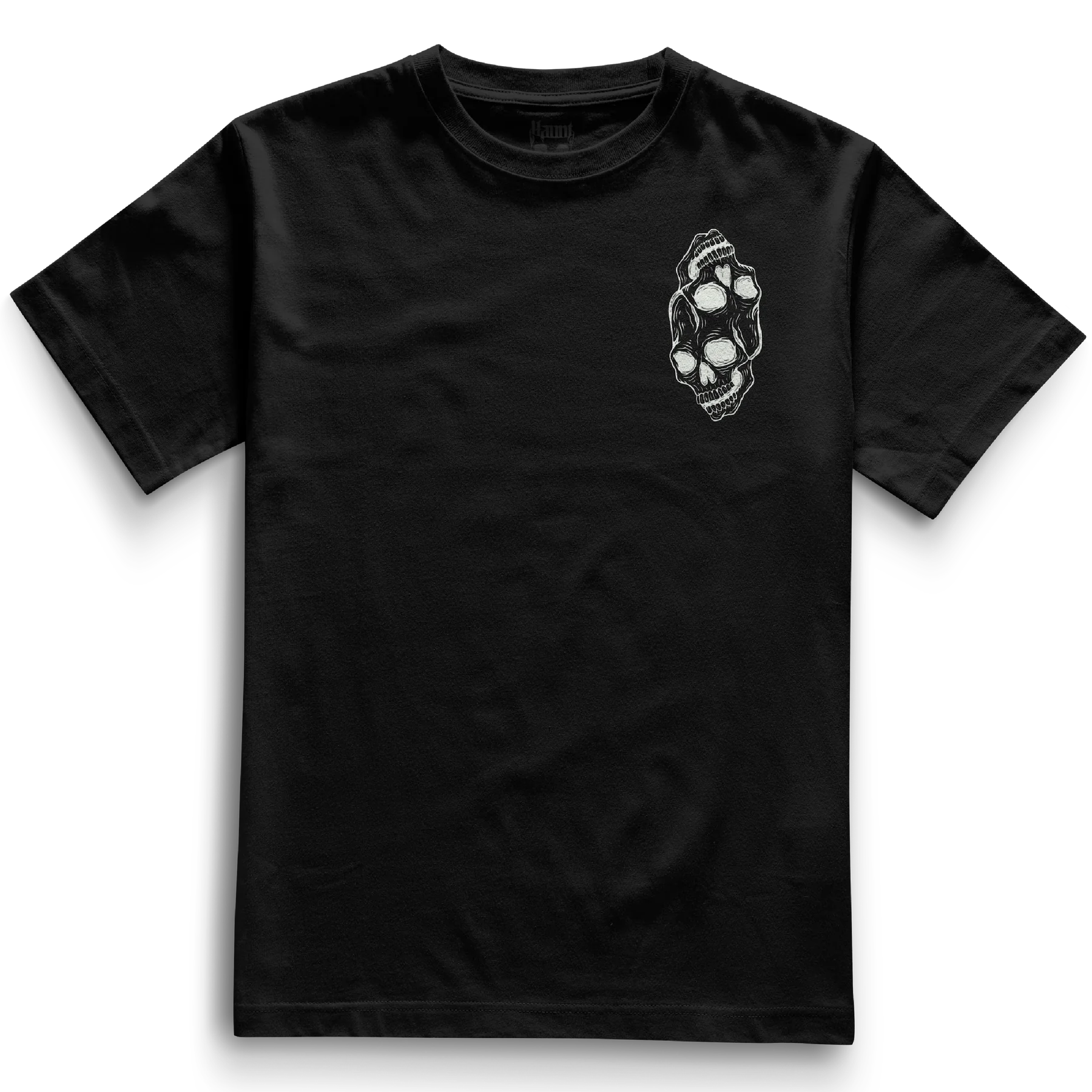 Front of the black Siamese Skulls t-shirt from Haunt’s Pocket Collection featuring two white skulls, one inverted, joined at the top in a bold tattoo-style design.
