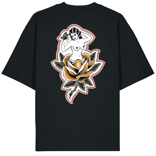 Back of the Softcore Bloom tee showing a pastel traditional rose with a topless woman blooming from it, holding a butterfly. Feminine, vintage-inspired tattoo design with soft pinks and bold linework.