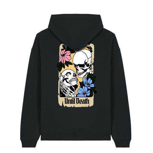 Back of the Until Death hoodie showing two skeletons in an embrace within a vintage card frame, with “Until Death” and tattoo-style floral details.