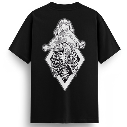 Back of the XXX-Ray black t-shirt displaying a black and white tattoo-style illustration of a topless woman revealing her ribcage in x-ray detail, set against a diamond-shaped frame.
